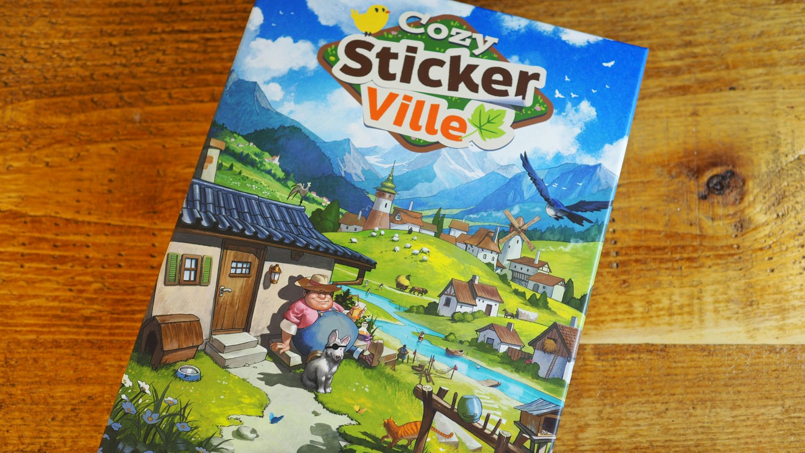 Cozy Stickerville box on a wooden surface
