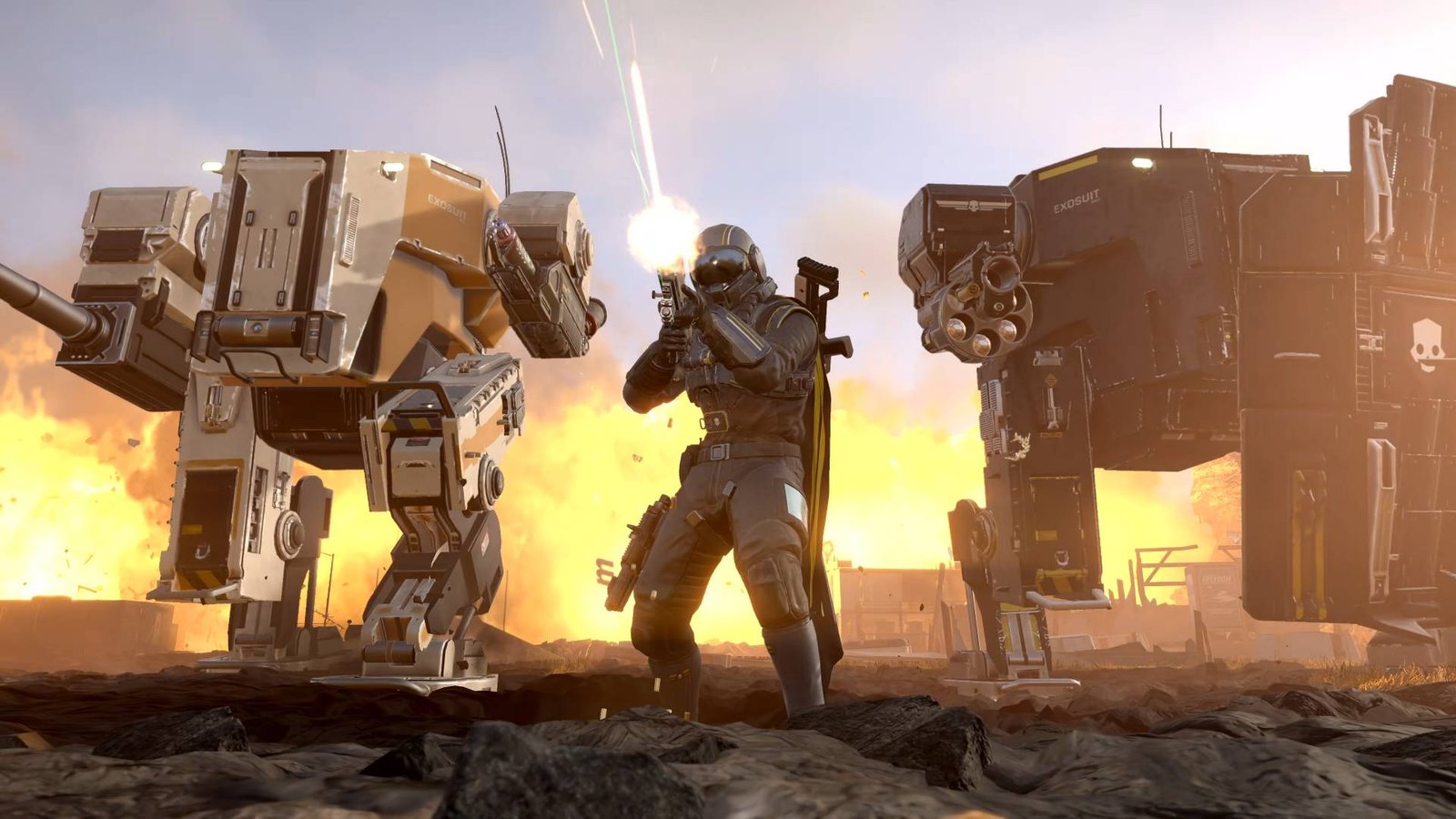 Helldivers 2 helldiver standing between lumberer and breakthrough mechs while firing gun